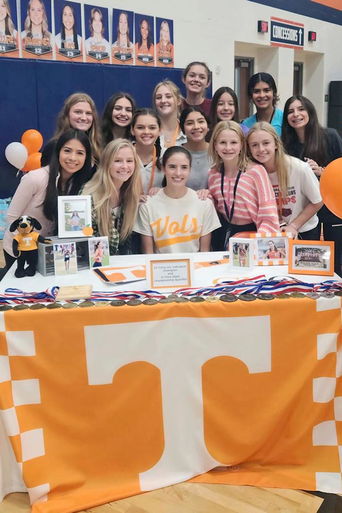 Bridgeland senior Emily Ellis, seated, signed her letter of intent to the University of Tennessee.